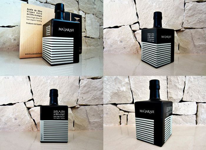 botella cuadrada para aceite de oliva lacada en negro con un diseño actual, elegante y serigrafiada en blanco con un tapón negro