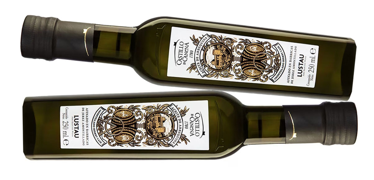 botellas pequeñas de aceite de oliva arbequina barricas roble copia